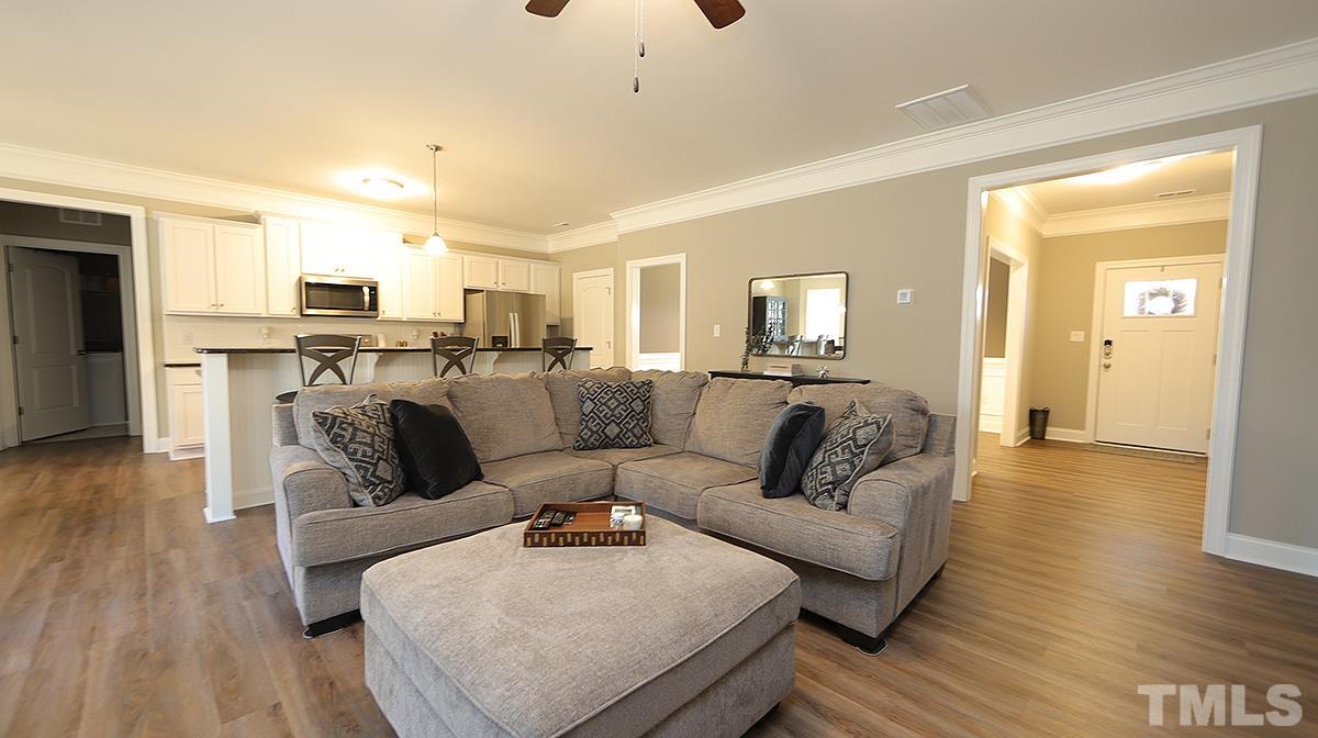 74 Flora Drive Benson, NC 27504 - Photo 9 of 33 a living room with furniture and a wooden floor