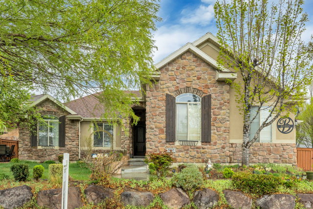 Undisclosed Address Lehi, UT 84048 - Photo 1 of 1 View of front of property with stone siding and roof with shingles