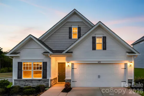 a front view of a house with garage