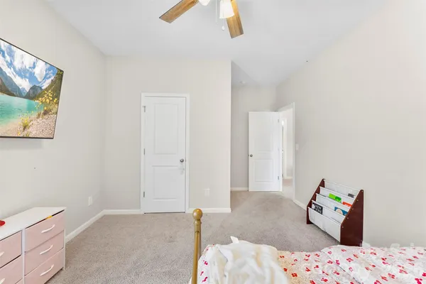 a bedroom with a bed and furniture