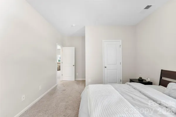 a bedroom with a bed and a cabinets