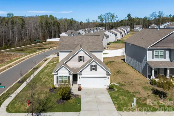 a view of a town with brick building in the background