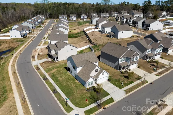 an aerial view of a house with outdoor space