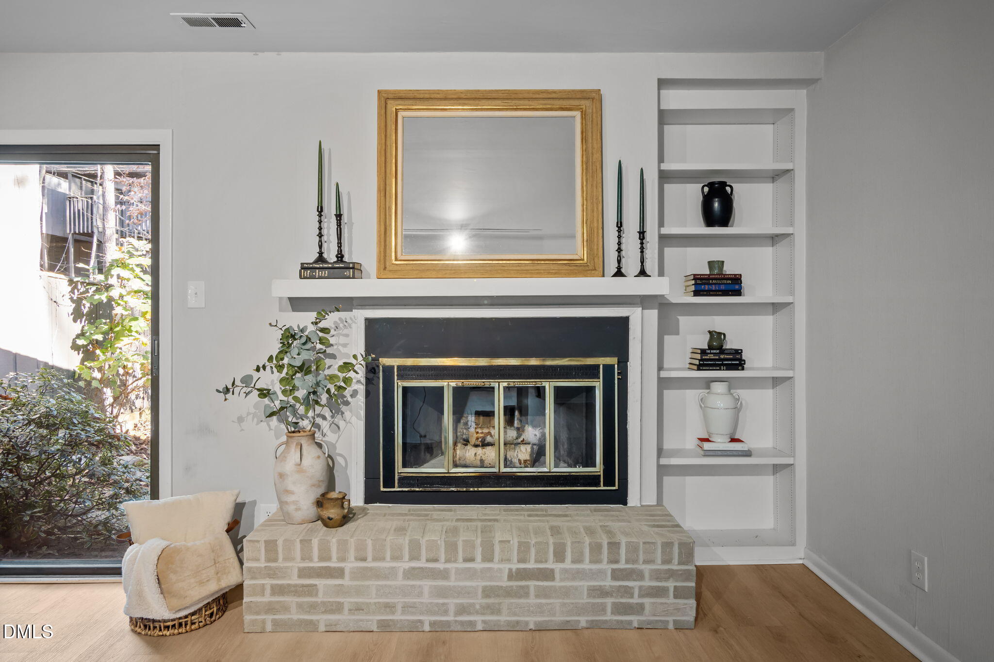 3080 Colony Road, Unit 3080C Durham, NC 27705 - Photo 13 of 57 a living room with a fireplace and a potted plant