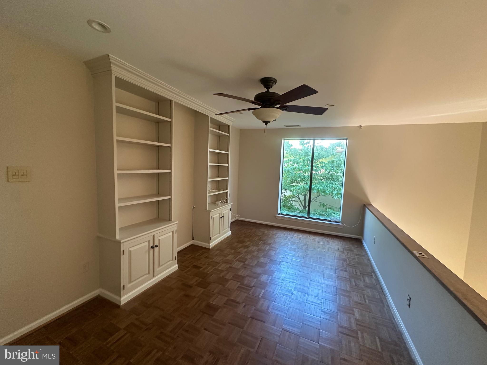 100 Llanalew Road, Unit 7 Haverford, PA 19041 - Photo 12 of 16 loft/built in cabinetry, parquet flooring,