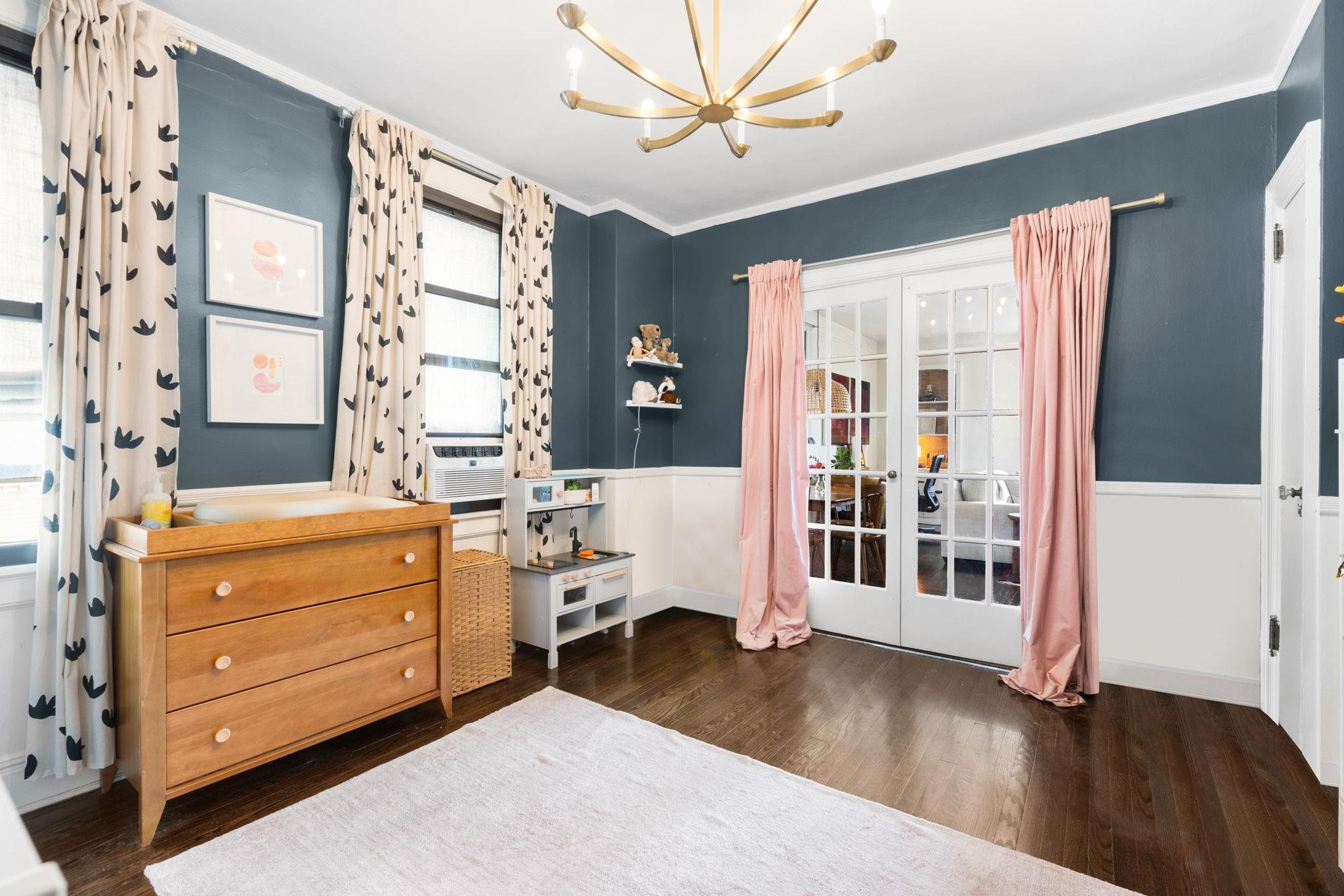 2600 John F. Kennedy Boulevard, Unit 7F Jersey City, NJ 07306 - Photo 12 of 22 a bedroom with a dresser and a window