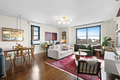 a living room with furniture dining area and a window