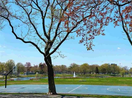 a view of a golf course with a big yard
