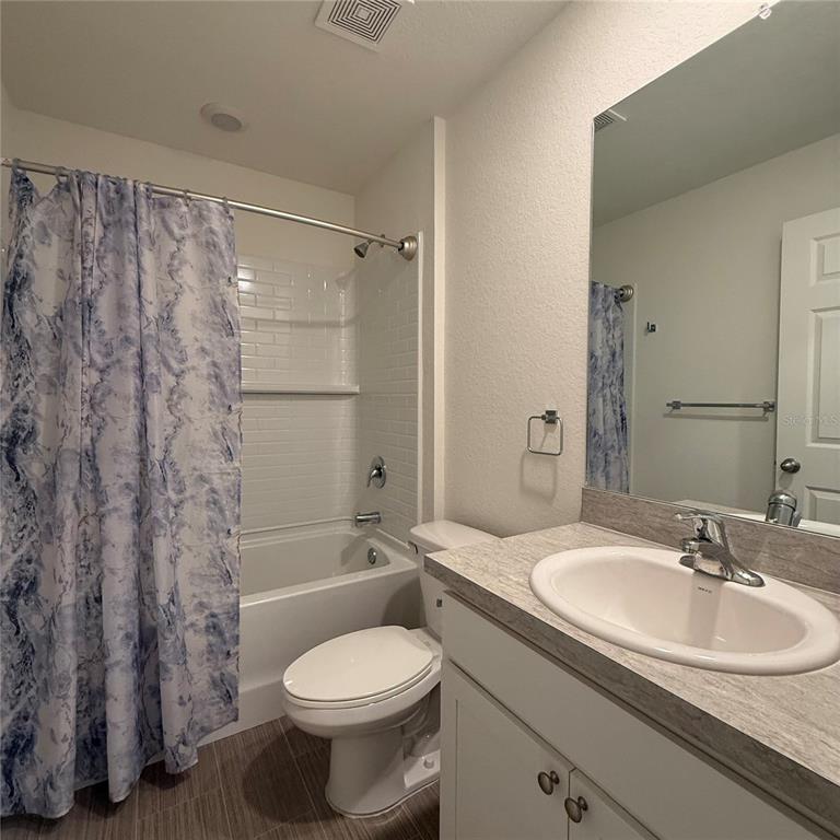 1542 Log Lane North Port, FL 34286 - Photo 23 of 27 a bathroom with a sink toilet and shower