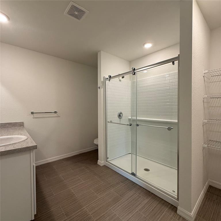1542 Log Lane North Port, FL 34286 - Photo 26 of 27 a bathroom with a glass shower door