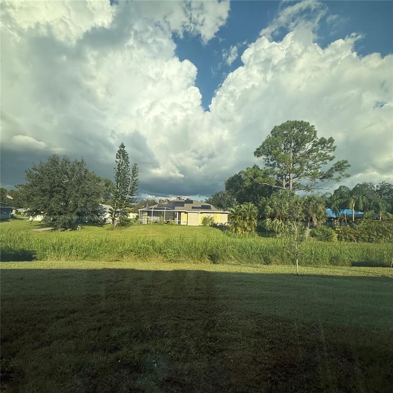 1542 Log Lane North Port, FL 34286 - Photo 7 of 27 a view of a lake with a big yard