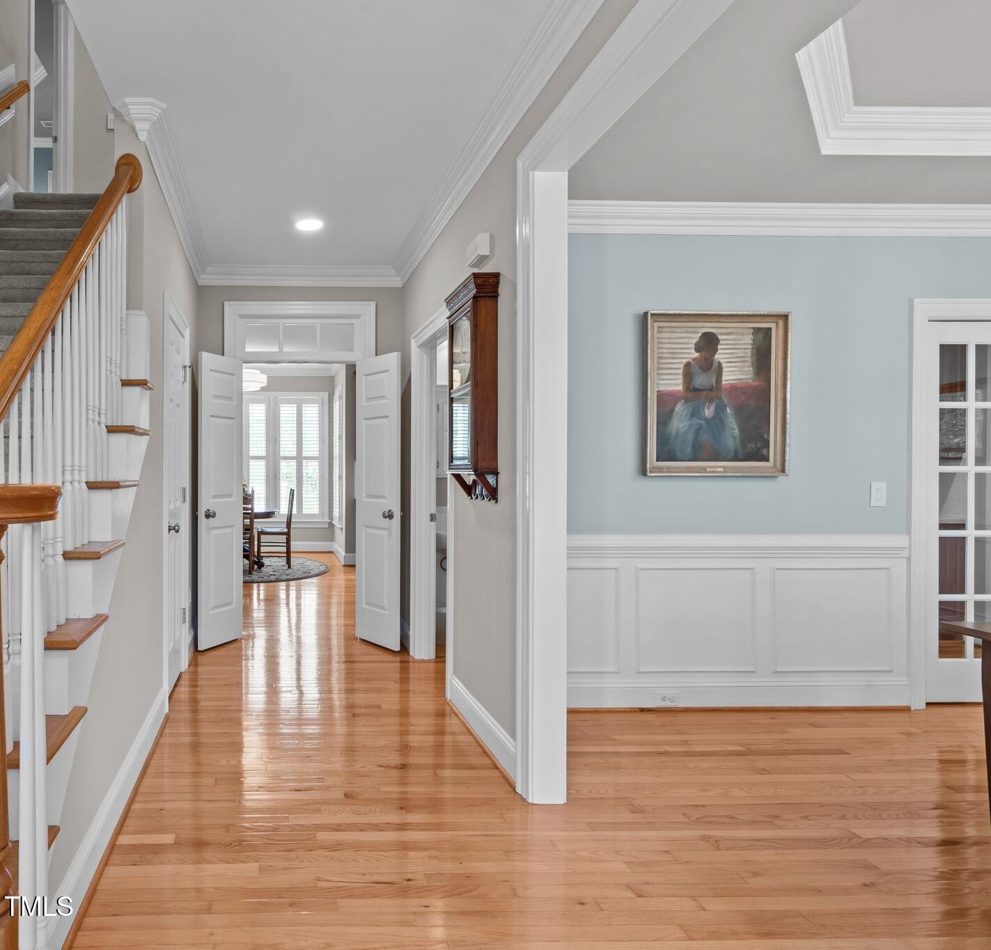 3708 Wesley Ridge Drive Apex, NC 27539 - Photo 11 of 48 a view of a hallway with wooden floor and staircase