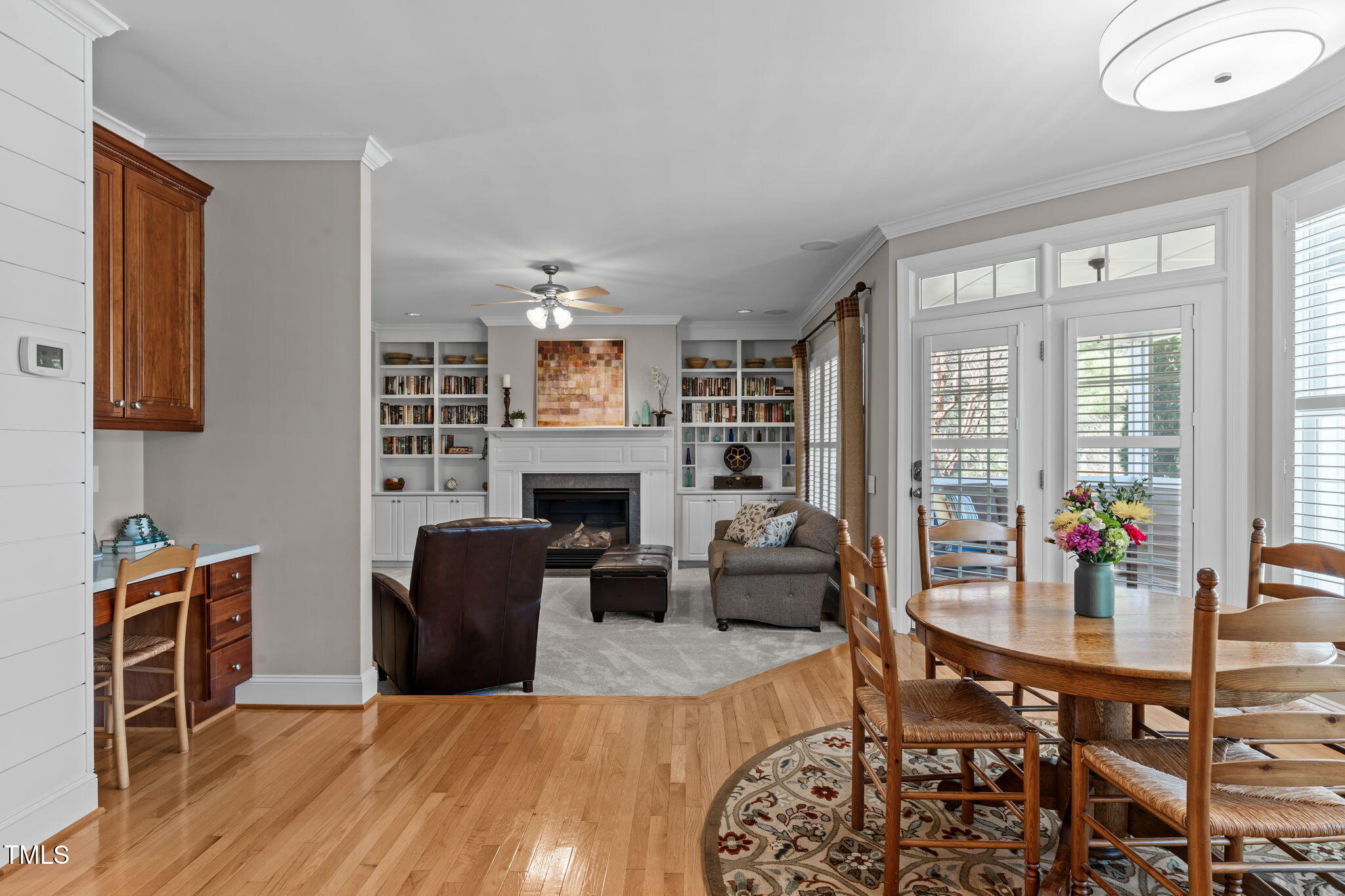 3708 Wesley Ridge Drive Apex, NC 27539 - Photo 17 of 48 a living room with furniture a fireplace and a large window