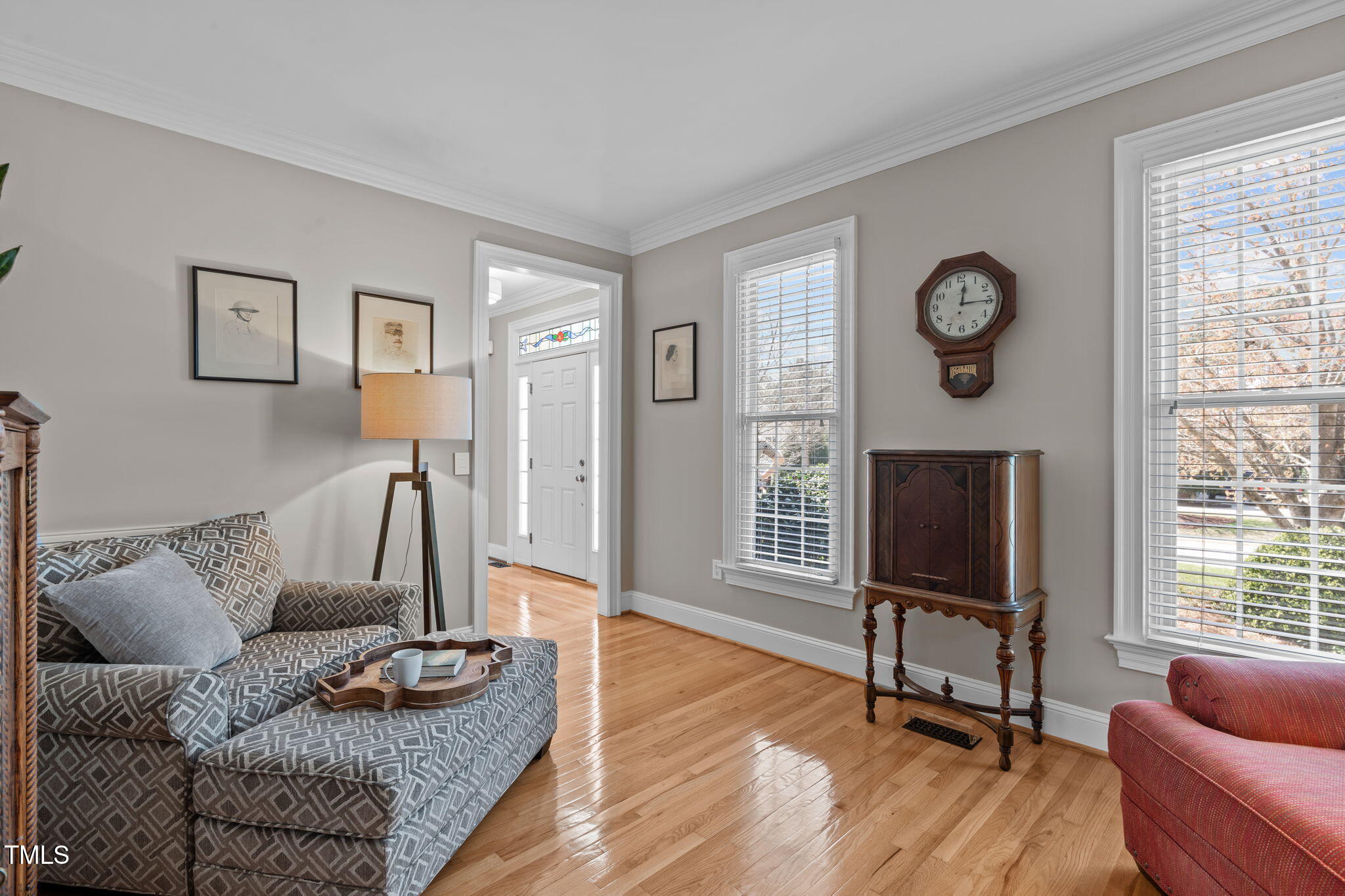 3708 Wesley Ridge Drive Apex, NC 27539 - Photo 20 of 48 a living room with furniture a flat screen tv and a fireplace