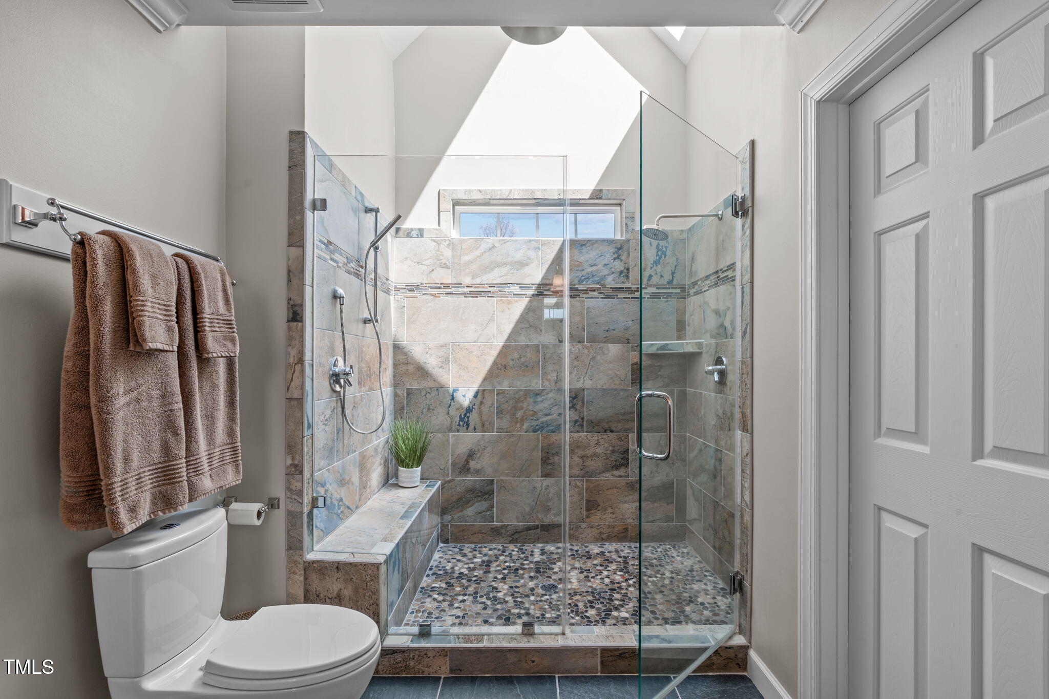 3708 Wesley Ridge Drive Apex, NC 27539 - Photo 25 of 48 a bathroom with a toilet and a shower