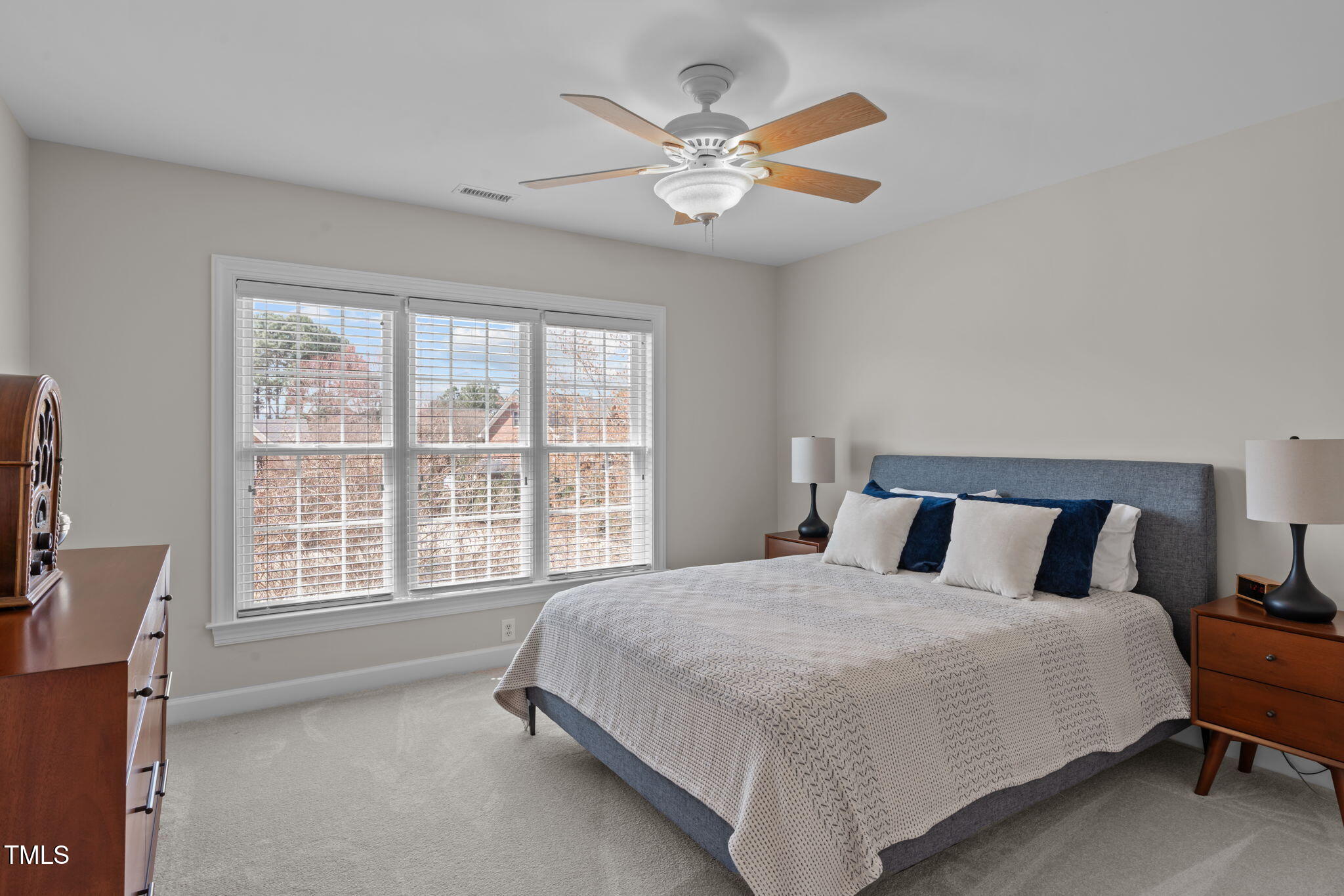 3708 Wesley Ridge Drive Apex, NC 27539 - Photo 27 of 48 a bedroom with a large bed and a large window