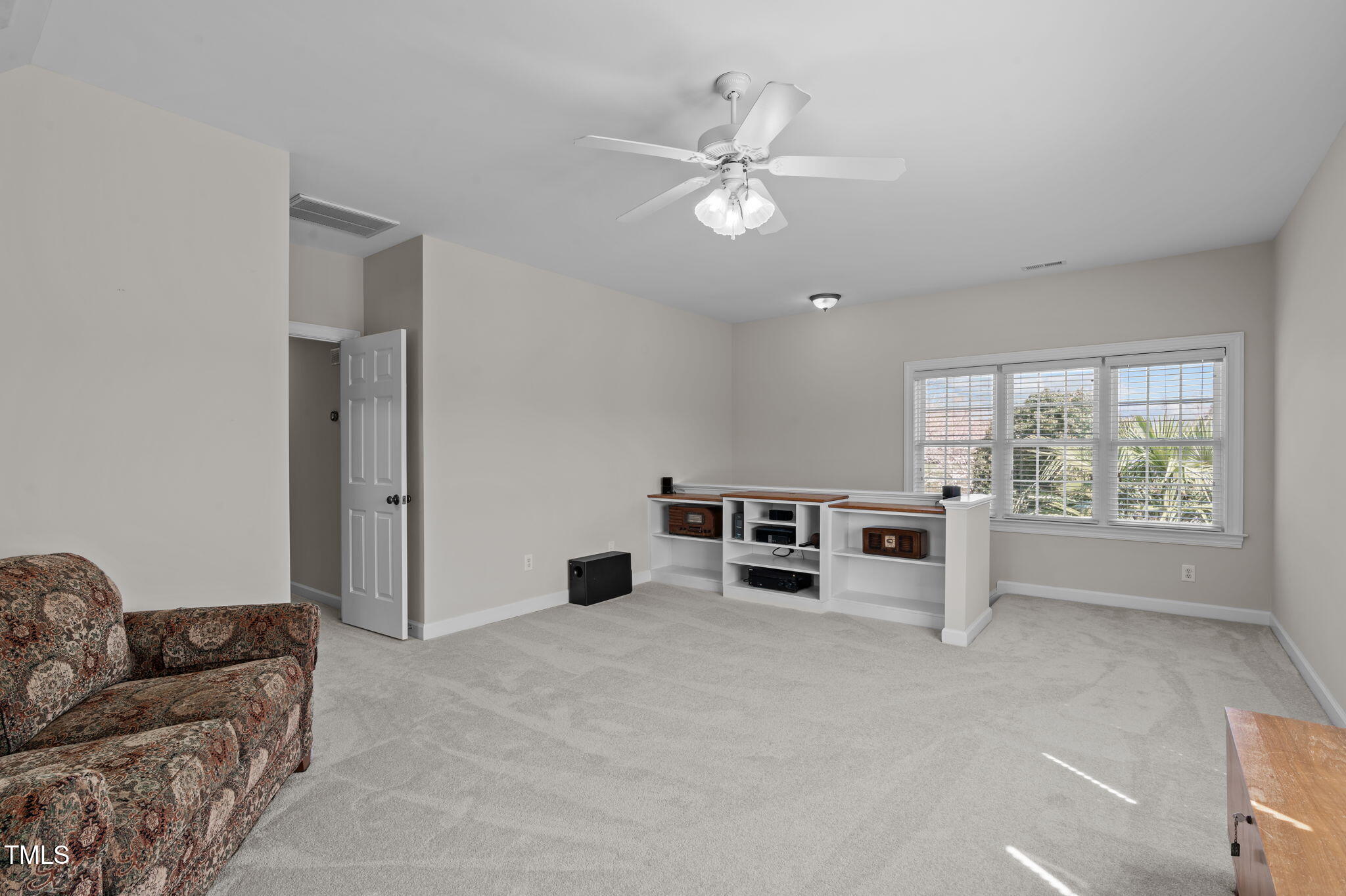 3708 Wesley Ridge Drive Apex, NC 27539 - Photo 32 of 48 a living room with furniture and white walls