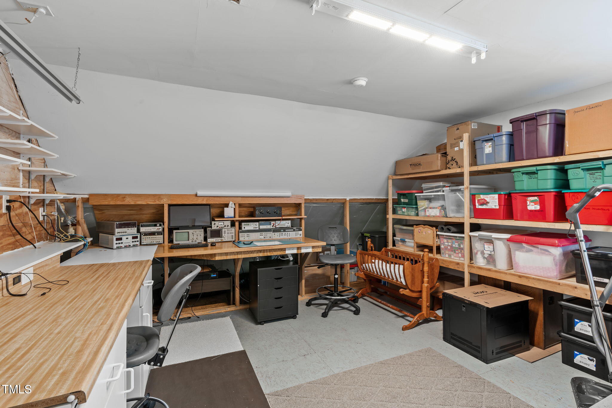 3708 Wesley Ridge Drive Apex, NC 27539 - Photo 38 of 48 a view of a workspace with furniture and a book shelf
