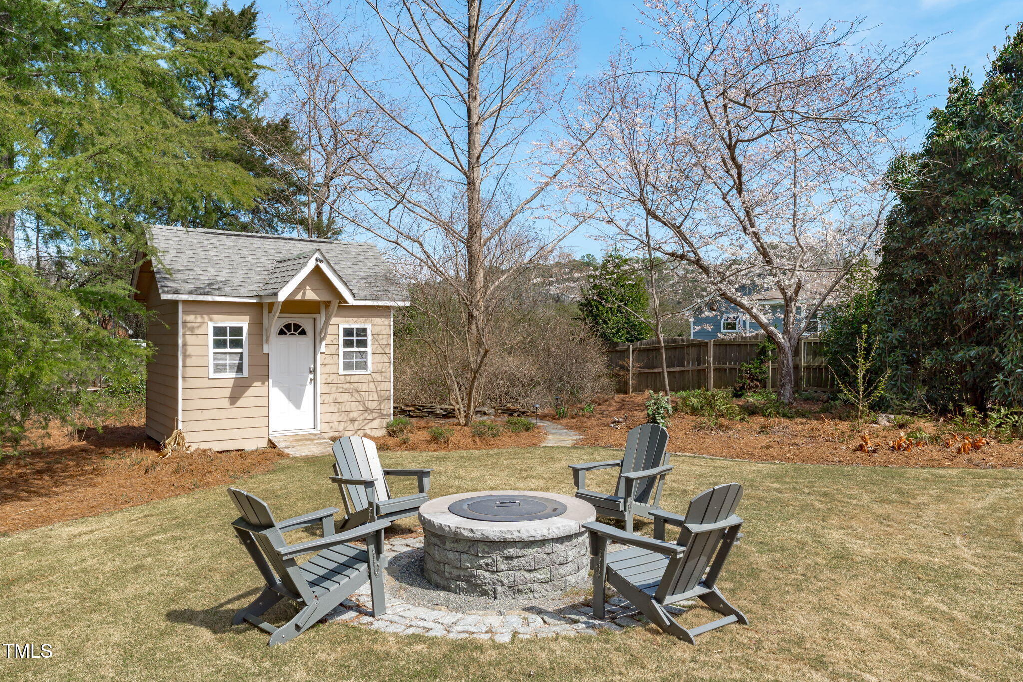 3708 Wesley Ridge Drive Apex, NC 27539 - Photo 43 of 48 a backyard of a house with table and chairs