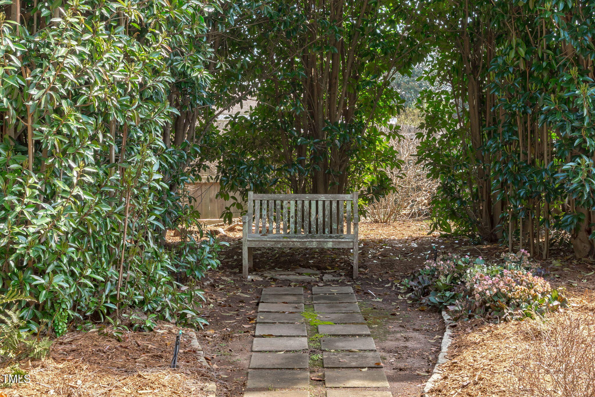 3708 Wesley Ridge Drive Apex, NC 27539 - Photo 44 of 48 a view of a bench in the garden