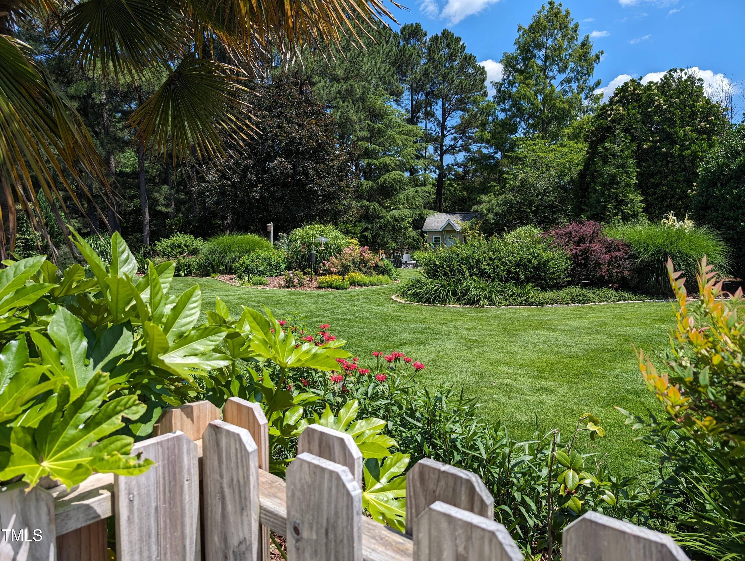 3708 Wesley Ridge Drive Apex, NC 27539 - Photo 4 of 48 a view of a garden with plants
