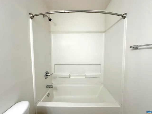 a bathroom with a shower and a sink
