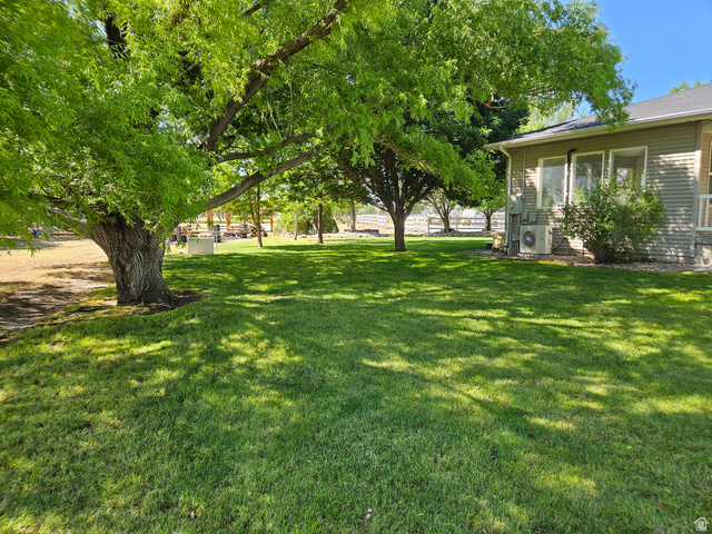 812 East Bates Cyn Road Tooele, UT 84074 - Photo 135 of 144 Expansive green lawn with mature shade trees