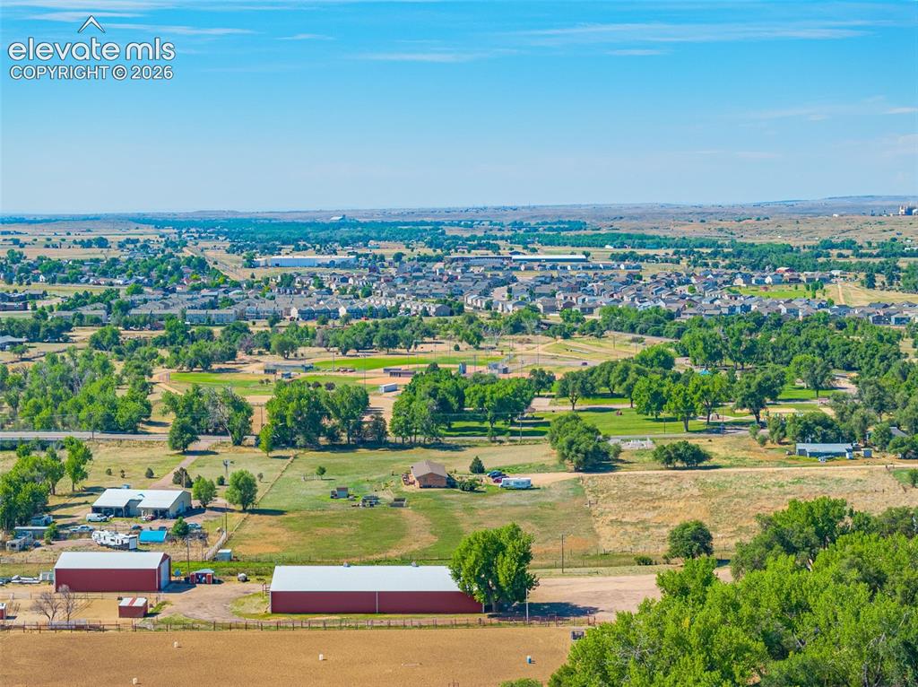 613 Wheat Field Road Fountain, CO 80817 - Photo 30 of 32 an aerial view of a city with lots of residential buildings ocean and an ocean view