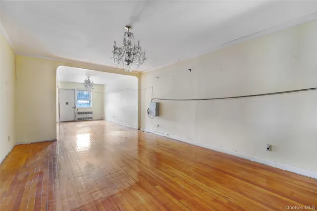 a view of a livingroom with wooden floor