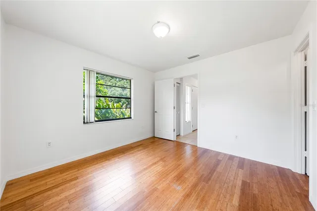 a bathroom with a granite countertop sink a toilet and bathtub