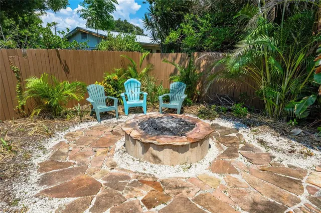 a view of a chair and table in the patio