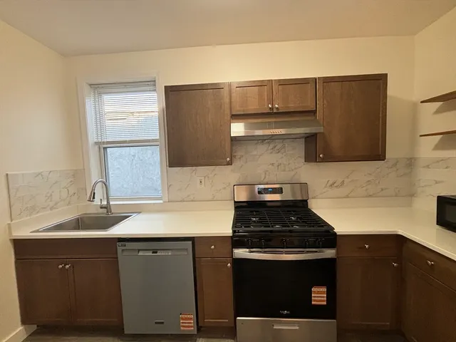a kitchen with a sink and cabinets
