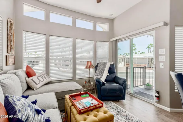 a living room with furniture and a large window