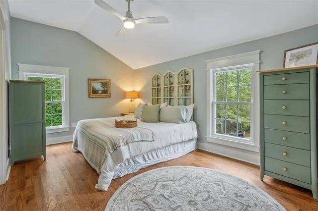 a bedroom with a large bed and a window
