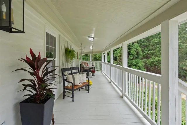 a view of a living room and balcony