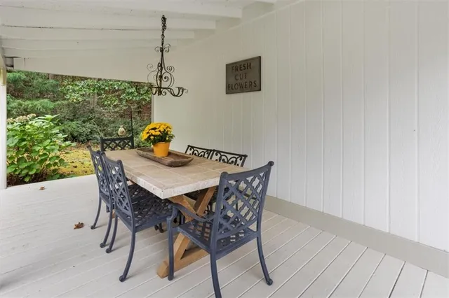 a view of a dining table and chairs in the room