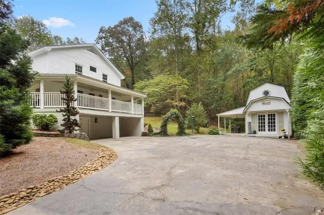 a front view of a house with a garden