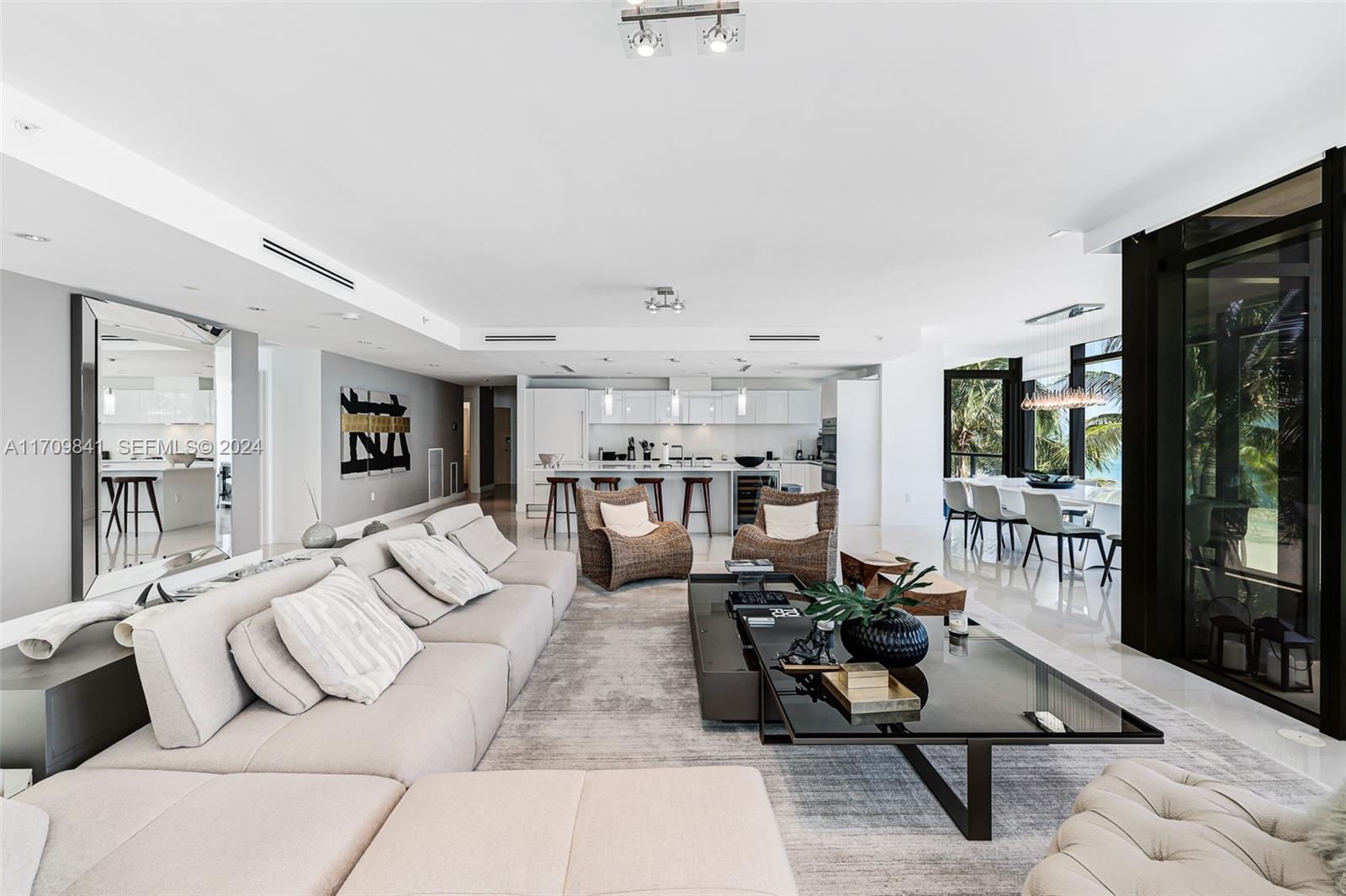2205 South Surf Road, Unit 3A Hollywood, FL 33019 - Photo 12 of 58 a living room with furniture kitchen view and large windows