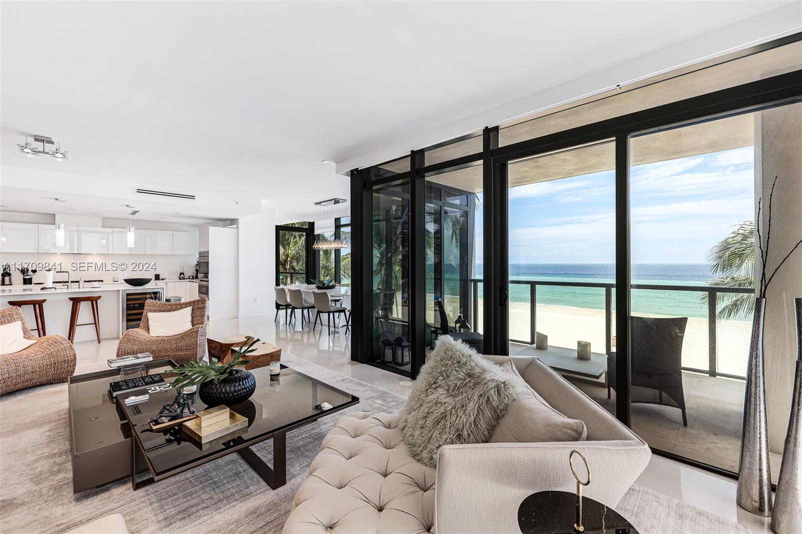 2205 South Surf Road, Unit 3A Hollywood, FL 33019 - Photo 13 of 58 a living room with furniture and large windows