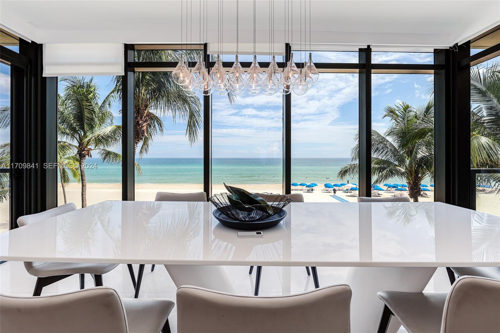 2205 South Surf Road, Unit 3A Hollywood, FL 33019 - Photo 16 of 58 a kitchen with a table chairs and outdoor view