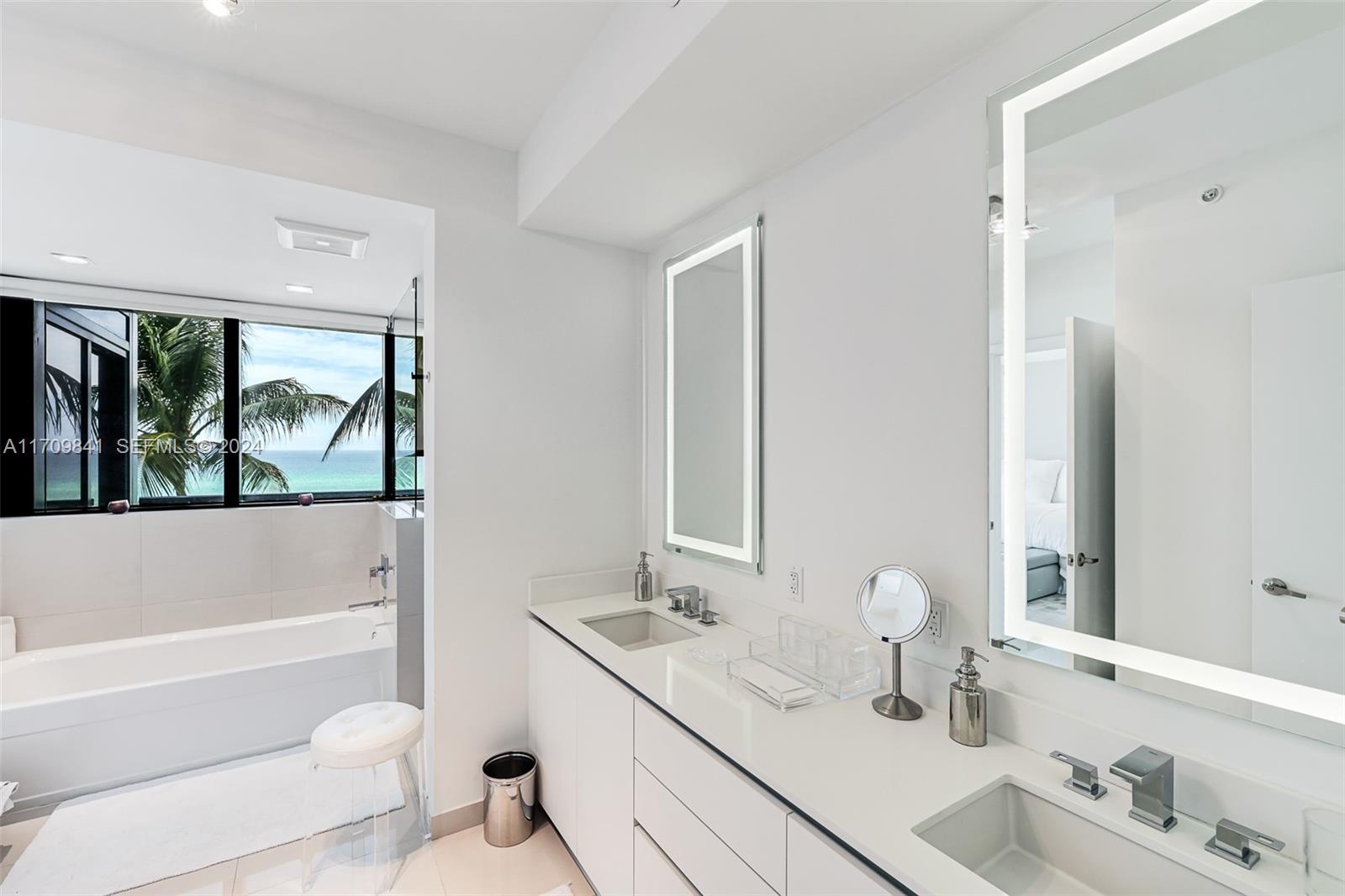 2205 South Surf Road, Unit 3A Hollywood, FL 33019 - Photo 23 of 58 a bathroom with a tub sink and mirror