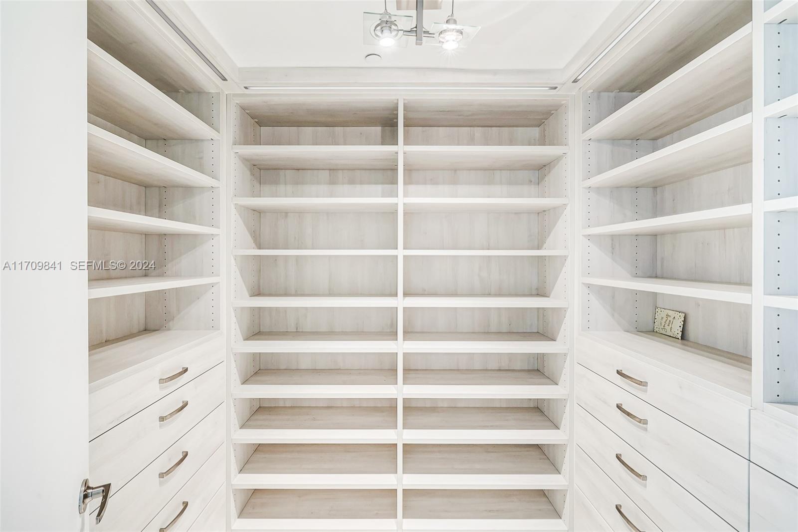 2205 South Surf Road, Unit 3A Hollywood, FL 33019 - Photo 24 of 58 a view of walk in closet with empty racks