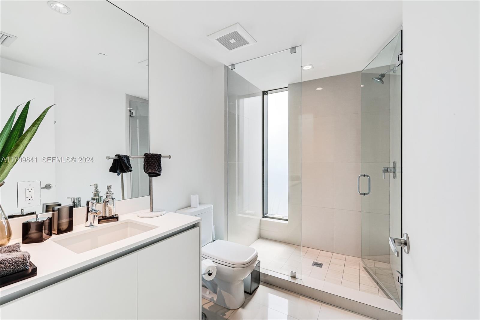 2205 South Surf Road, Unit 3A Hollywood, FL 33019 - Photo 28 of 58 a bathroom with a granite countertop sink a toilet and shower