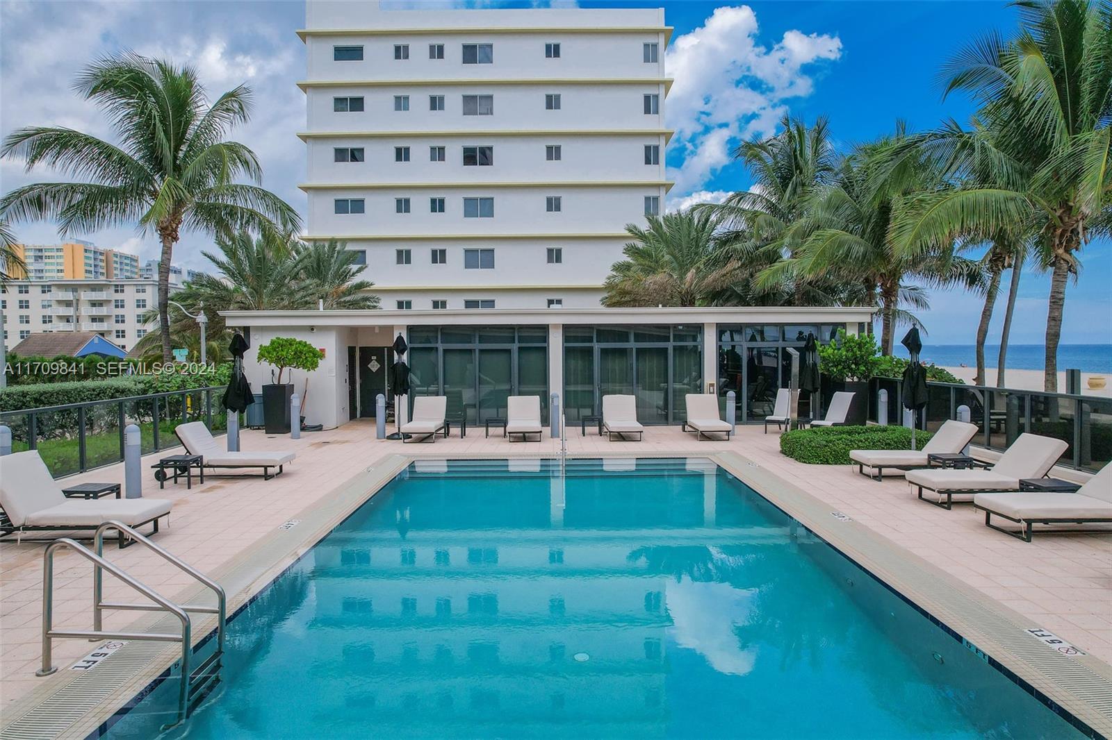 2205 South Surf Road, Unit 3A Hollywood, FL 33019 - Photo 38 of 58 a view of a house with swimming pool and sitting area