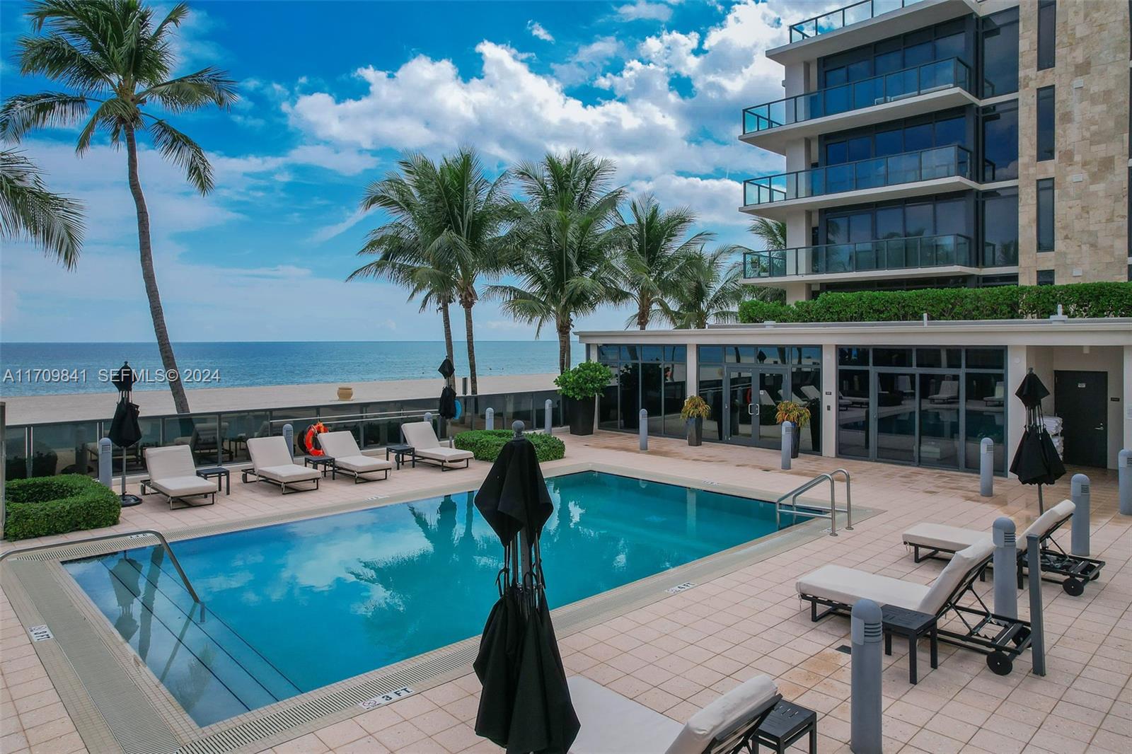 2205 South Surf Road, Unit 3A Hollywood, FL 33019 - Photo 40 of 58 a view of a backyard with a patio and a garden