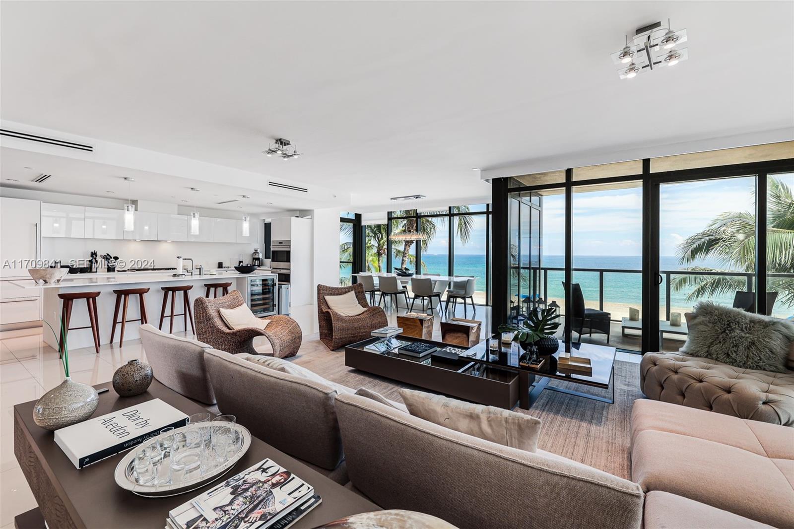 2205 South Surf Road, Unit 3A Hollywood, FL 33019 - Photo 4 of 58 a living room with furniture and a large window with balcony view