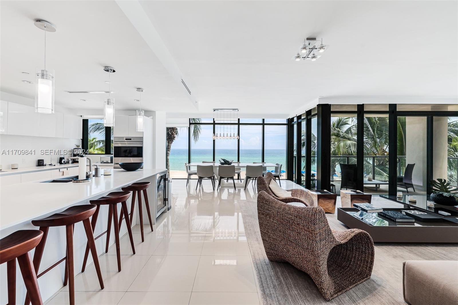 2205 South Surf Road, Unit 3A Hollywood, FL 33019 - Photo 6 of 58 a living room with furniture and large windows