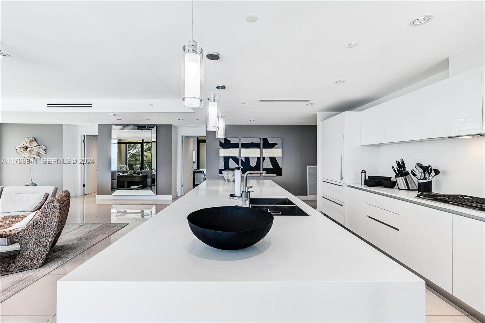2205 South Surf Road, Unit 3A Hollywood, FL 33019 - Photo 9 of 58 a kitchen with stainless steel appliances a sink a stove a washer and a refrigerator
