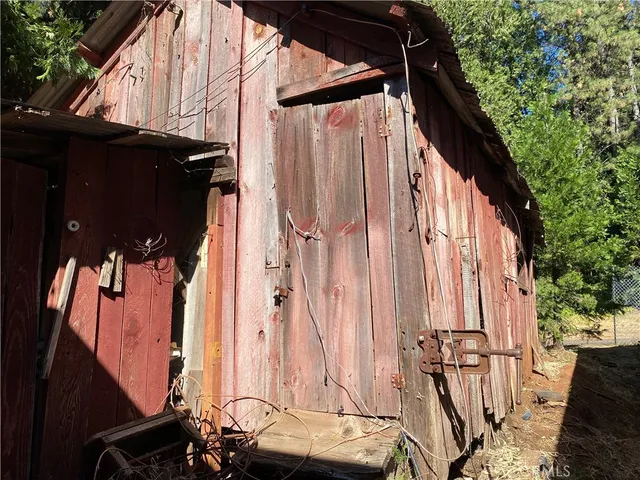 a view of balcony with furniture and garden