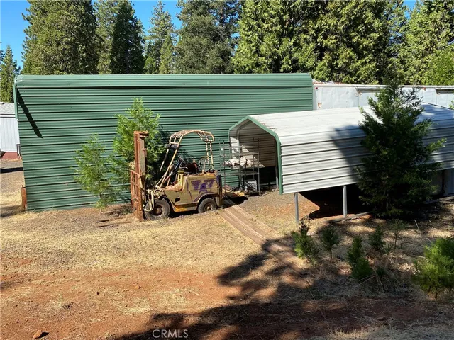 a view of a patio with two chairs and a table